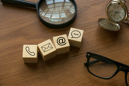 Variety of contact approach. Icon of phone, email, post and chat on a wooden cube.