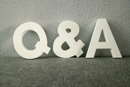 Question and answers concept. Wooden alphabet of letter q and a.