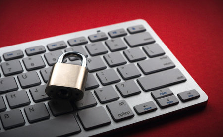 Computer security concept. Locked padlock on laptop keyboard.Computer is protected from online...