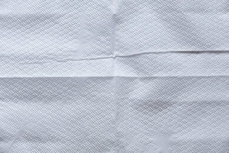 White folded tissue background and texture.