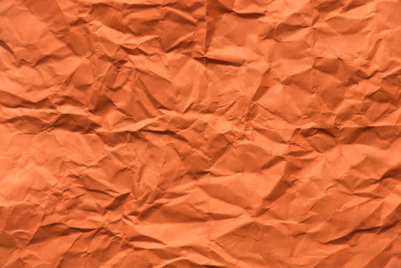 Orange crumpled paper for background.の写真素材