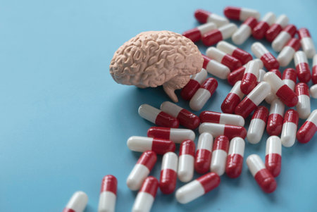 Concept of brain diseases, mental health, Alzheimer's, Parkinson's disease, dementia, stroke, and seizure. Nootropics use to improve memory and neural function. Brain model with a pills.の写真素材