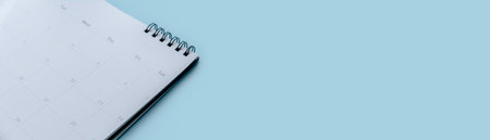 Concept of plan a monthly calendar for meetings or manage your daily activities.Blue banner. Copy...