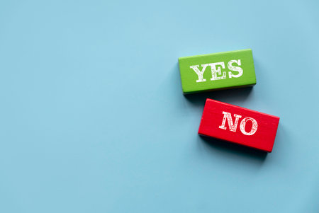 Consider Yes Or No Decisions When Making Business Decisions in Tough Circumstances. Wooden color...