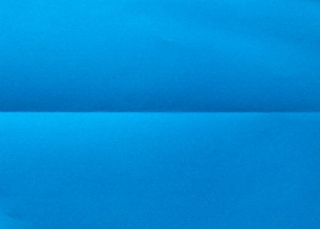 Folded blue paper for background.