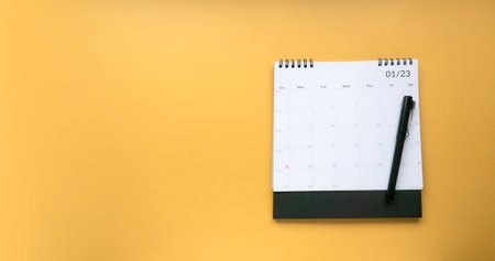 Concept of plan a monthly calendar for meetings or manage your daily activities.Yellow banner. Copy...