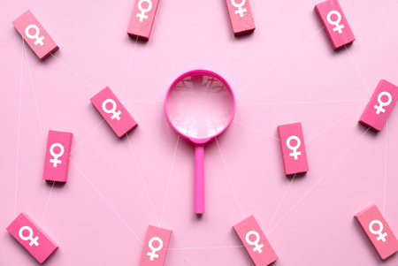 Questions and answers about women concept. Women symbol over a wooden rectangular with pink magnifying glass on pink background.の写真素材
