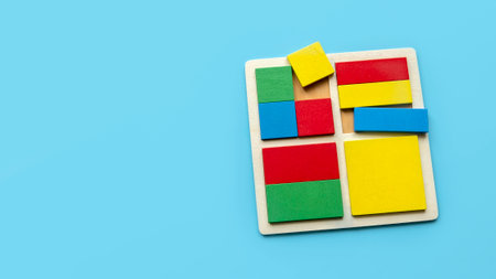 Colorful square and rectangular shape of puzzle isolated on blue background with copy space.の写真素材