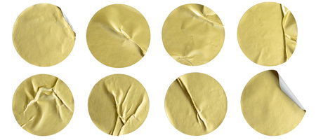 A set of blank gold round adhesive paper sticker label isolated on white background.の写真素材