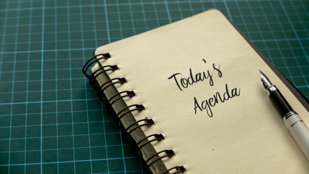 Top view of pen and notebook written with Today's Agenda.の写真素材