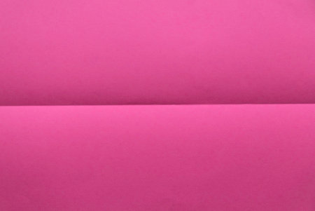 Folded pink color paper for background.の写真素材