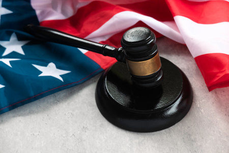 USA Flag and Gavel Symbolizing Law, Justice, and American Legal Systemの写真素材