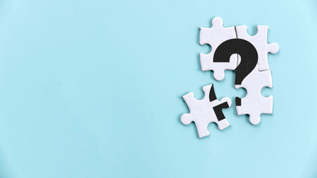 Mystery Jigsaw Puzzle Piece with Question Mark: Concept of Unsolved Problem and Missing Informationの写真素材
