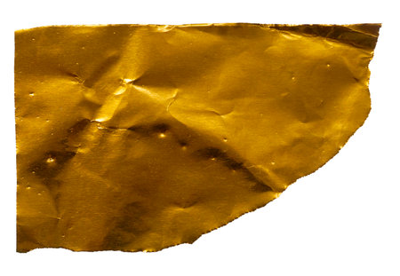 Crushed Gold Paper Fragment with Torn Edges: Elegant Texture and Luxury Detailの写真素材