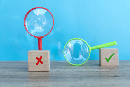 Concept of evaluation. True or false symbol. Accepted or rejected. Yes or no icon over a wooden cubeの写真素材