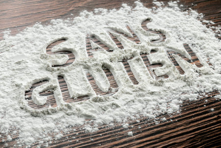 Sans gluten written on a sprinkled flour powder.の写真素材