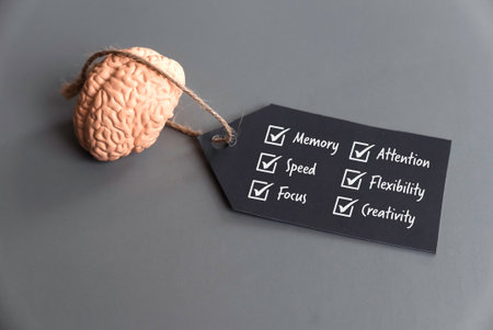 Brain with Tag Highlighting Cognitive Skills: Memory, Speed, Focus, Attention, Flexibility, Creativityの写真素材