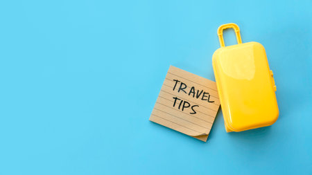Travel Tips Note with Yellow Suitcase on Blue Background