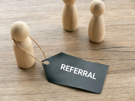 Referral Concept with Wooden People Figurines for Team Collaboration and Networkingの写真素材