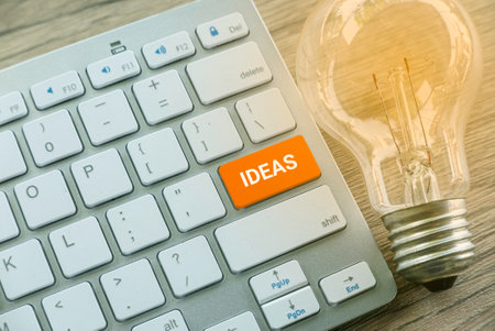 Innovative Ideas Concept with Keyboard and Light Bulb