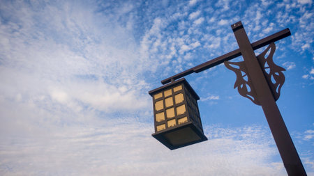 Vintage Lantern Hanging Against a Clear Blue Sky