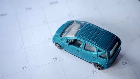 Mobility and Planning: Miniature Car on a Calendarの写真素材