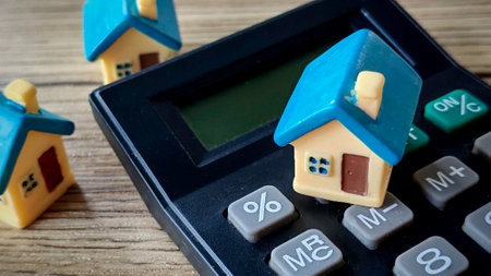 Small Yellow House Model on Calculatorの写真素材