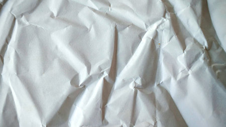 creased white paper background and textureの写真素材