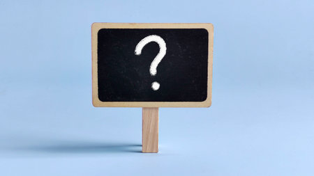 Chalkboard or Blackboard Featuring a Prominent Question Symbol Representing Inquiry, Curiosity, and the Quest for Knowledgeの写真素材