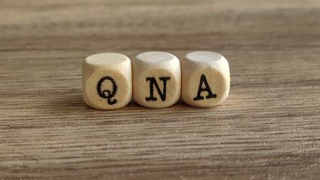 QNA Blocks on a Wooden Surface