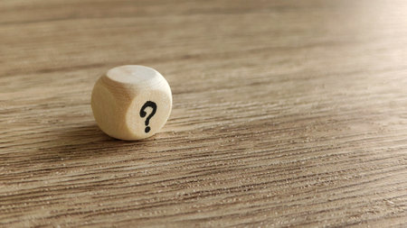 A Wooden Dice with Question Marksの写真素材