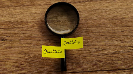Top-down view of a magnifying glass on a wooden desk with two sticky notes, one labeled Quantitative...