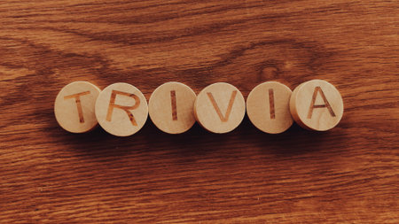 Trivia Word Spelled with Wooden Letters on a Rustic Wood Backgroundの写真素材