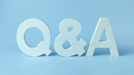Question and Answer Session Concept: White Q&A Letters on a Clean Blue Backgroundの写真素材