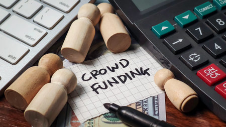 Crowdfunding Investment Strategy: People Figurines and Calculator for Startup Financeの写真素材
