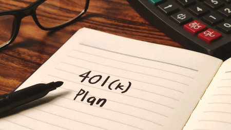 Planning Retirement: Notebook Entry for 401(k) Plan with Calculator and Financial Toolsの写真素材