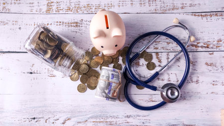 Stethoscope, Piggy Bank, and Money: Analyzing Healthcare Savings, Medical Fund Budget, and Health Insurance Costsの写真素材