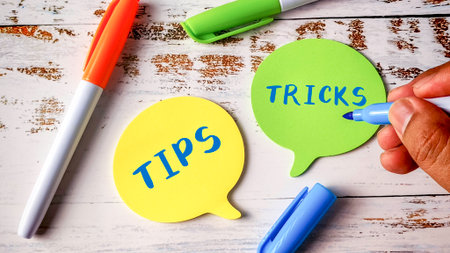 Tips and Tricks Advice Concept with Hand Writing on Colorful Speech Bubble Note Padsの写真素材