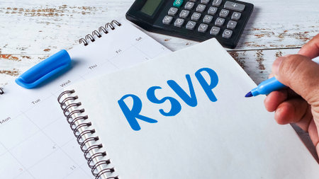 RSVP Respond Invitation Confirmation Concept with Hand Writing on Notepad and Calendarの写真素材