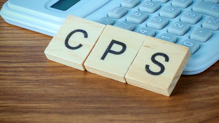 Wooden Scrabble Tiles Spelling CPS on a Calculator for Business and Financial Conceptsの写真素材