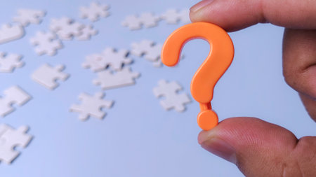 Question Mark Icon and Puzzle Pieces Representing Problem Solving and Finding Solutions to a Mysteryの写真素材