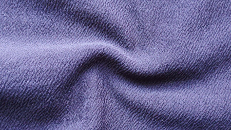 Wavy Deep Purple Fabric Texture Background with Flowing Folds and Shadowed Creases Creating Elegant...