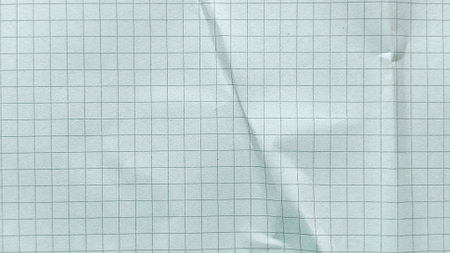 Crumpled white grid paper texture background with realistic folds and square pattern detailの写真素材