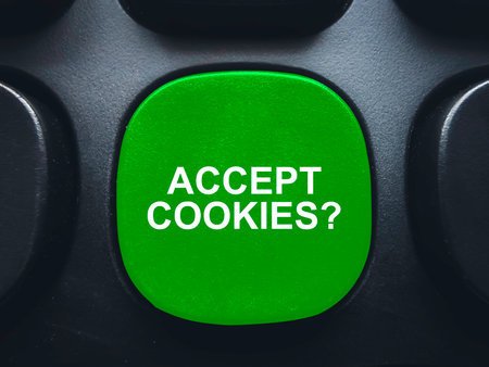 Green accept cookies button on computer keyboard for website privacy and data tracking consent