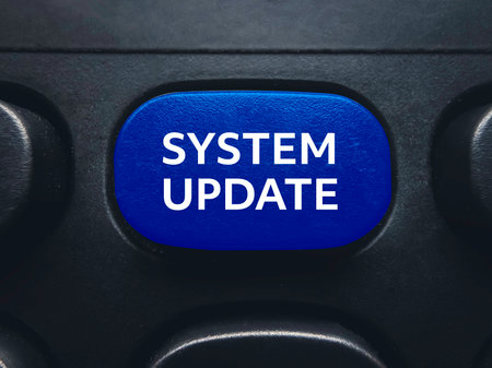 Blue system update button on computer keyboard for software maintenance and latest version upgrade