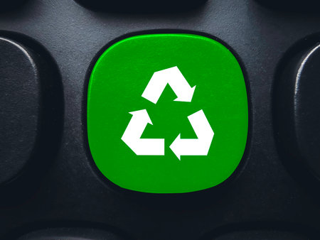 Green recycle symbol button on keyboard for environmental conservation and sustainable technology conceptsの写真素材