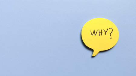 Yellow speech bubble with why handwritten text on blue background representing questioning and customer supportの写真素材