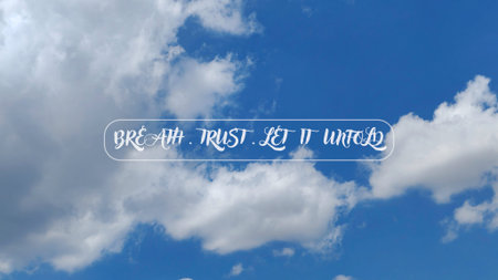 Breathe Trust Let It Unfold Inspirational Quote on Blue Sky with Soft White Clouds and Frameの写真素材