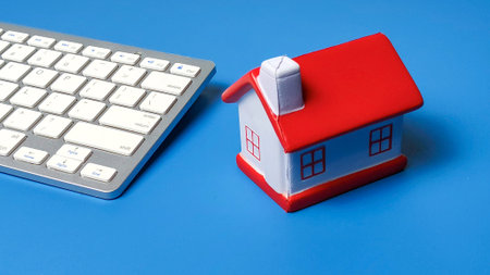 Real Estate Online Search and Working From Home Concept with House and Keyboard