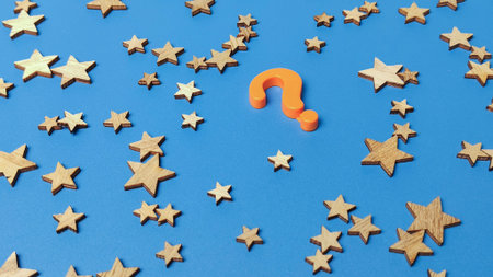 Choosing the Best Option and Quality Doubt Concept with Question Mark and Wooden Stars on Blue...